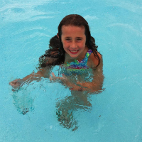 smiling girl swimming